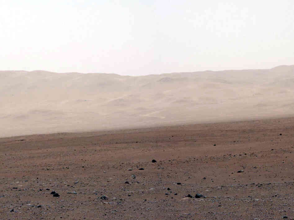 This image of the crater wall is north of the landing site, or behind the rover. Here, a network of valleys believed to have formed by water erosion enters Gale Crater from the outside. This is the first view scientists have had of a fluvial system - one relating to a river or stream — from the surface of Mars.