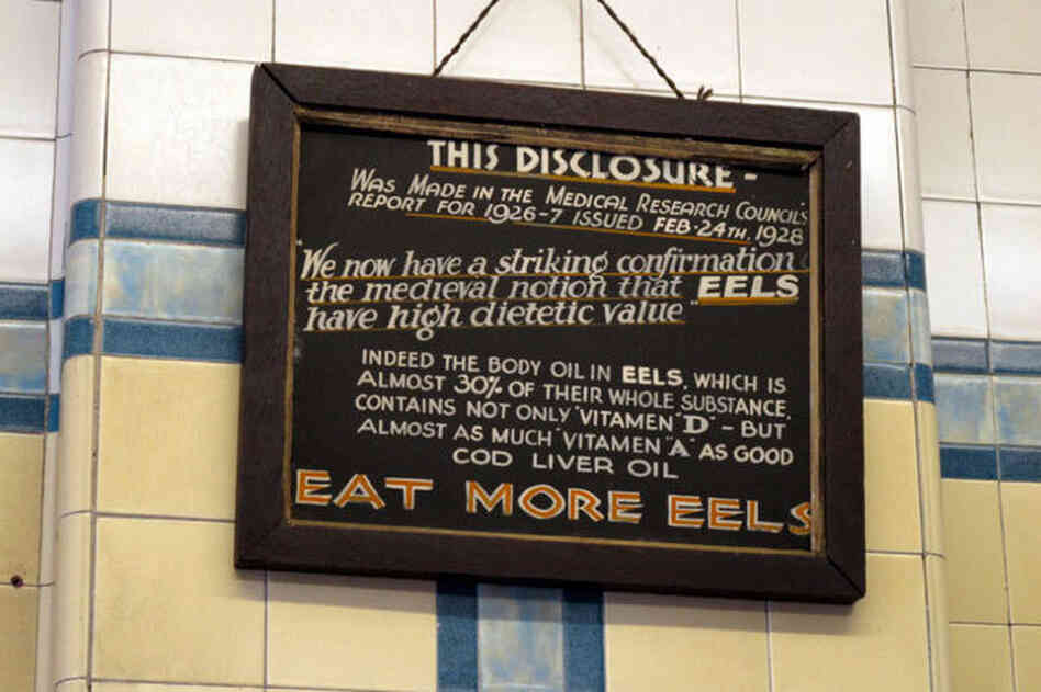 A sign on the wall at F. Cooke's shop in London.