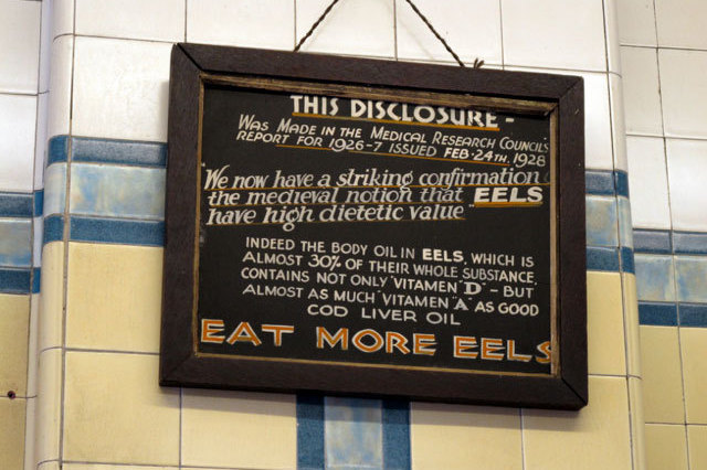 A sign on the wall at F. Cooke's shop in London.