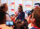 Gabby Douglas sits in the Olympic Media Lounge at Westfield Stratford City in London. During the Olympics, Douglas' Facebook fanbase grew by nearly 4,000 percent. Gabby Douglas sits in the Olympic Media Lounge at Westfield Stratford City in London. During the Olympics, Douglas' Facebook fanbase grew by nearly 4,000 percent.