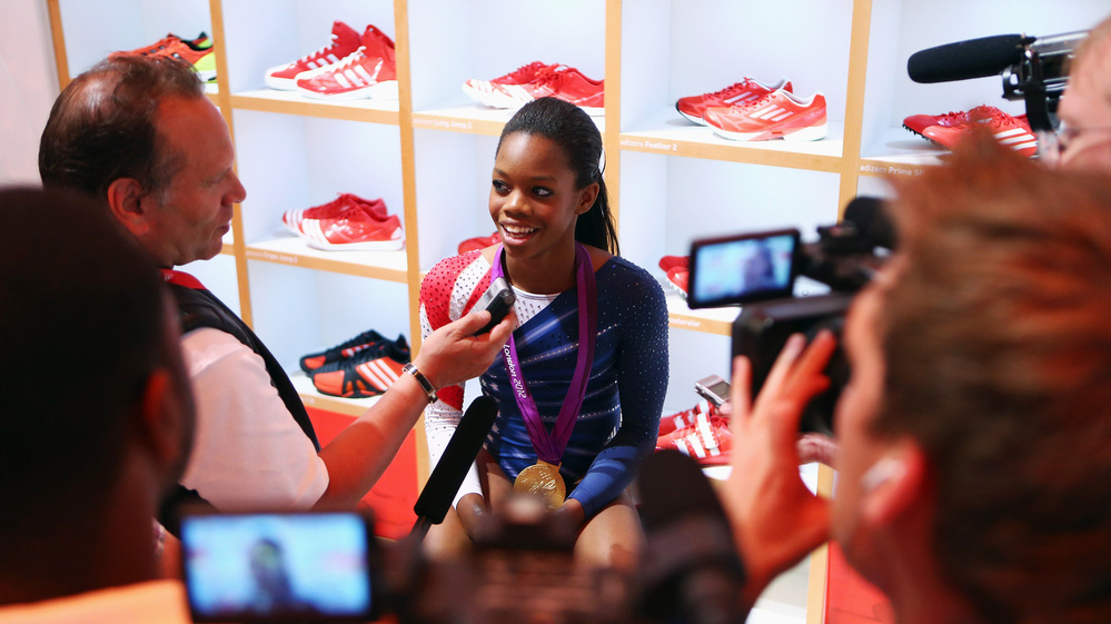 Gabby Douglas sits in the Olympic Media Lounge at Westfield Stratford City in London. During the Olympics, Douglas' Facebook fanbase grew by nearly 4,000 percent.