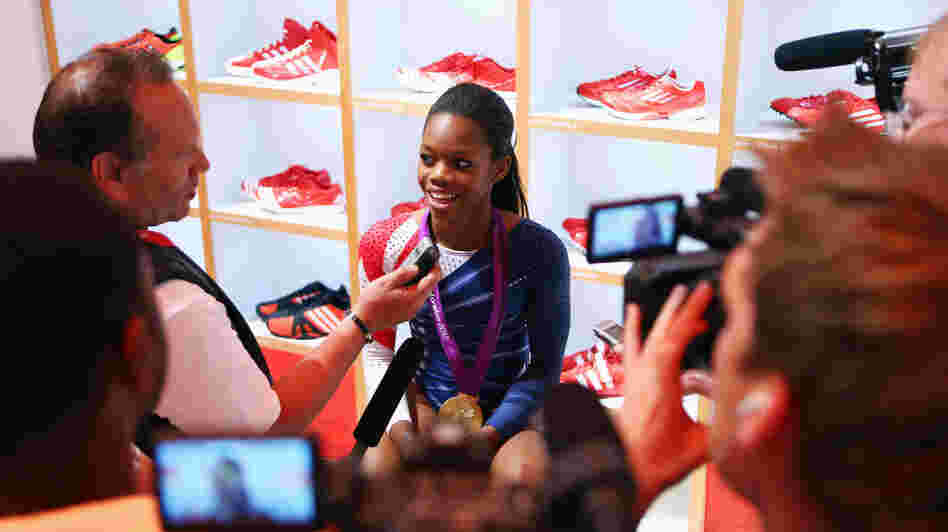 Gabby Douglas sits in the Olympic Media Lounge at Westfield Stratford City in London. During the Olympics, Douglas' Facebook fanbase grew by nearly 4,000 percent.