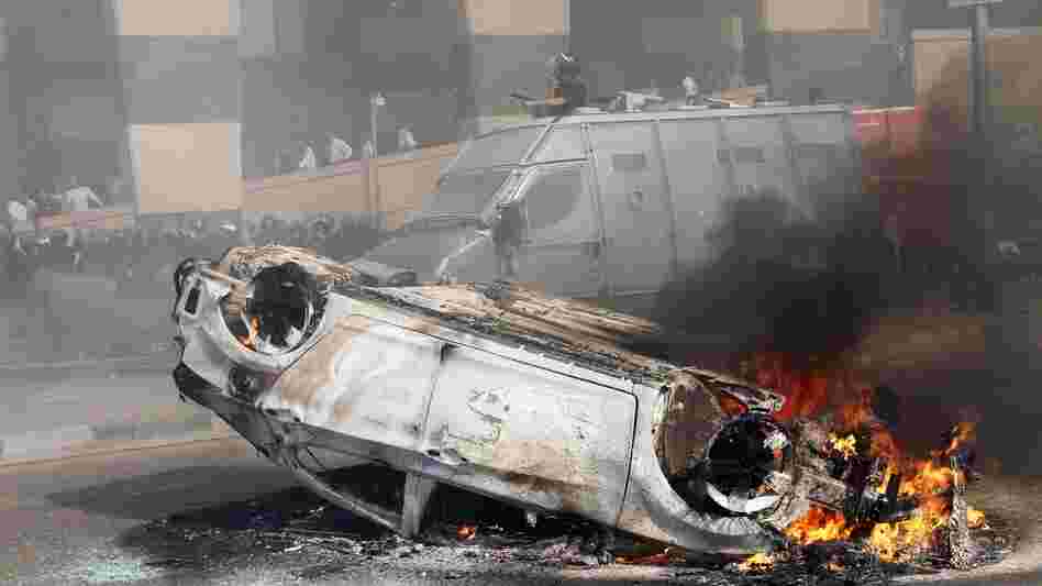 A car burns after riots break out in front of a luxury hotel in central Cairo on Aug. 2. Cairo and other parts of Egypt have seen an increase in crime and lawlessness since the country's revolution last year. A car burns after riots break out in front of a luxury hotel in central Cairo on Aug. 2. Cairo and other parts of Egypt have seen an increase in crime and lawlessness since the country's revolution last year.