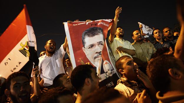 In Cairo Sunday night, thousands of Egyptians shouted political slogans in support of President Mohamed Morsi.