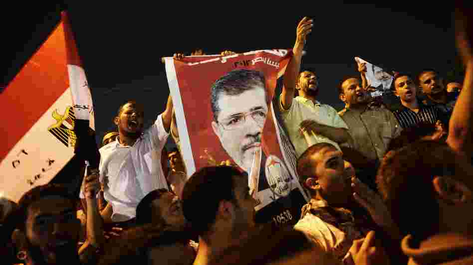 In Cairo Sunday night, thousands of Egyptians shouted political slogans in support of President Mohamed Morsi.