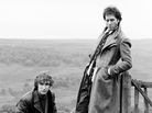 British actors Richard E. Grant and Paul McGann posing for the cover art of the movie 'Withnail & I' in Cumbria, 1986. British actors Richard E. Grant and Paul McGann posing for the cover art of the movie 'Withnail & I' in Cumbria, 1986.