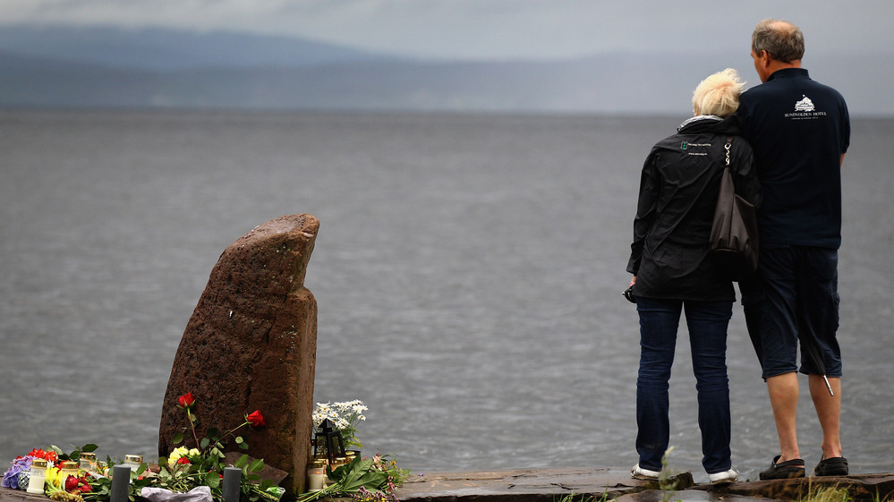 July 24, 2011: A man and woman look out across Tyrifjorden Lake towards Utoya Island, where 69 of the victims were killed.