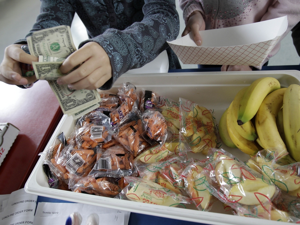 A student at Fairmeadow Elementary School buys fruits and vegetables in Palo Alto, Calif., in 2010.