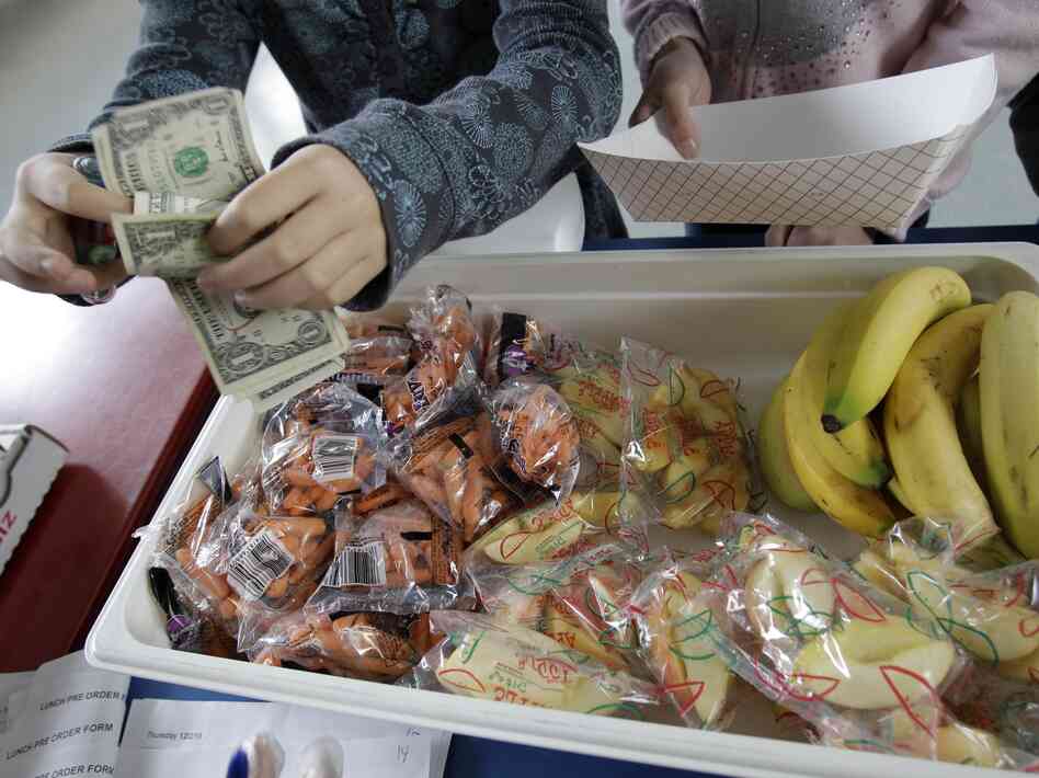 A student at Fairmeadow Elementary School buys fruits and vegetables in Palo Alto, Calif., in 2010.
