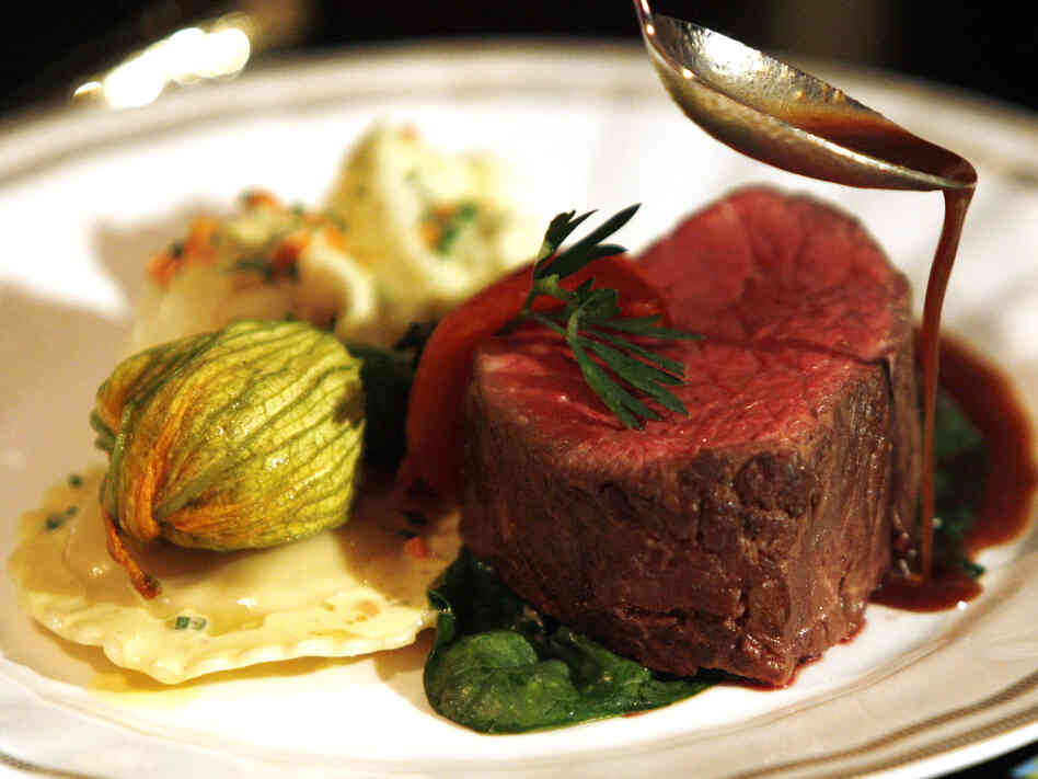 The entree course of filet mignon, polenta ravioli with cauliflower and vadouvan butter, whole roasted zucchini blossom, bloomsdale spinach, and pinot noir sauce that will be served at the 2009 Creative Arts and 61st Primetime Emmy Governors Balls is seen during a news conference in Los Angeles on Thursday, Aug. 20, 2009. (AP Photo/Matt Sayles) The entree course of filet mignon, polenta ravioli with cauliflower and vadouvan butter, whole roasted zucchini blossom, bloomsdale spinach, and pinot noir sauce that will be served at the 2009 Creative Arts and 61st Primetime Emmy Governors Balls is seen during a news conference in Los Angeles on Thursday, Aug. 20, 2009. (AP Photo/Matt Sayles)