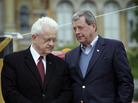 Democratic Rep. Leonard Boswell (left) talks with Republican Rep. Tom Latham on May 7, 2010, in Des Moines, Iowa. Redistricting is now pitting the longtime Iowa congressmen in a general election battle. Democratic Rep. Leonard Boswell (left) talks with Republican Rep. Tom Latham on May 7, 2010, in Des Moines, Iowa. Redistricting is now pitting the longtime Iowa congressmen in a general election battle.