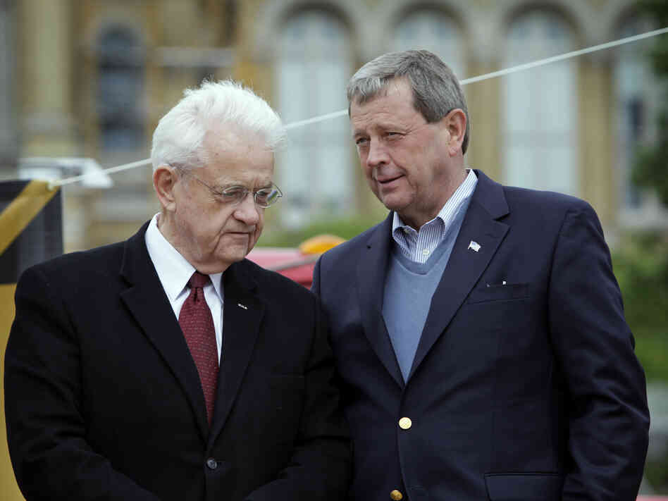Democratic Rep. Leonard Boswell (left) talks with Republican Rep. Tom Latham on May 7, 2010, in Des Moines, Iowa. Redistricting is now pitting the longtime Iowa congressmen in a general election battle. Democratic Rep. Leonard Boswell (left) talks with Republican Rep. Tom Latham on May 7, 2010, in Des Moines, Iowa. Redistricting is now pitting the longtime Iowa congressmen in a general election battle.