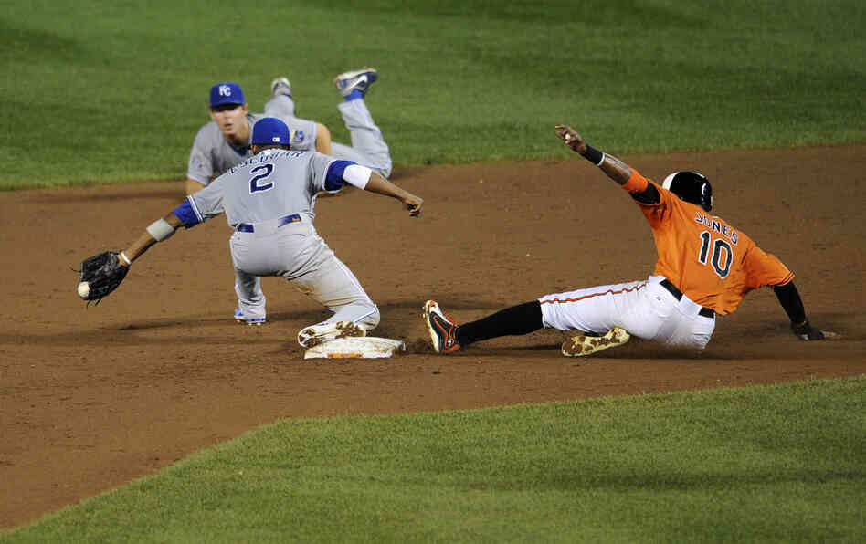 Baltimore Orioles center fielder Adam Jones is out at second against Kansas City Royals shortstop Alcides Escobar. Despite less-than-stellar statistics, the Orioles are contenders in the American League wild-card race.
