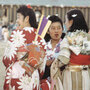 Young women wearing kimonos chat during an Obon celebration honoring ancestors at the Heart Mountain Relocation Center in Wyoming.