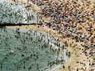 According to the National Oceanic and Atmospheric Administration, the past year through June 2012 has been the hottest year in the continental U.S. since modern record-keeping started in 1895. Above, New Yorkers flocked to Coney Island to try to beat the heat in early August.
