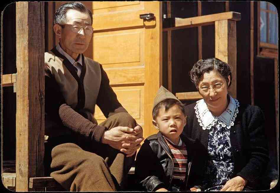 Billy Manbo sits with his maternal grandparents, Junzo (left) and Riyo Itaya.