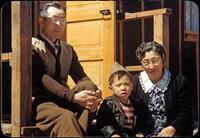 Billy Manbo sits with his maternal grandparents, Junzo (left) and Riyo Itaya.