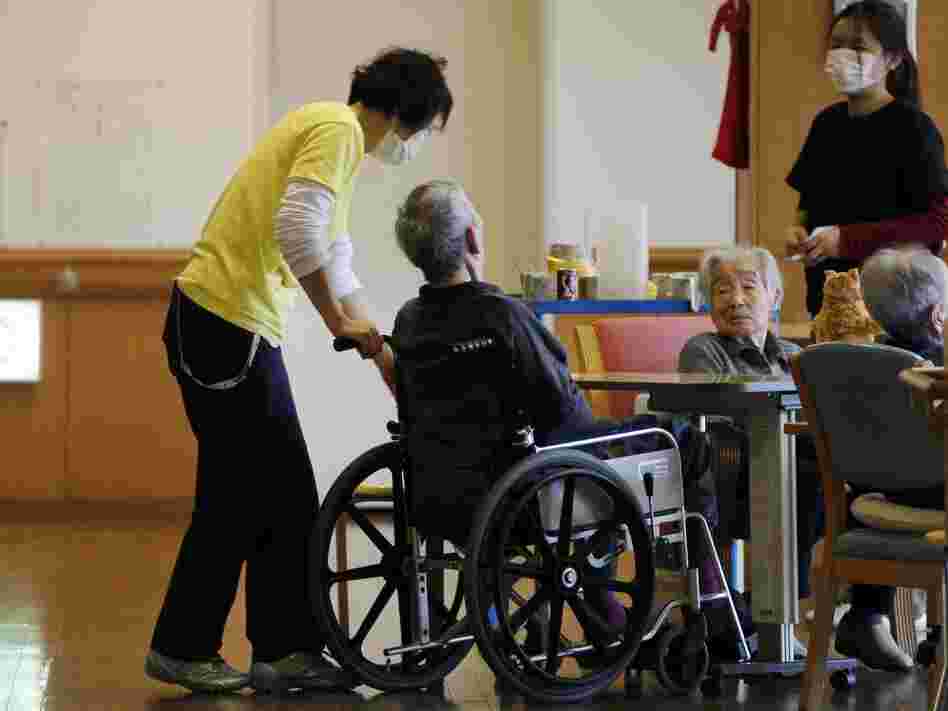 Care managers tend elderly people in March 2012 in Minamisoma, Japan. The home's residents were evacuated eight days after the Fukushima Dai-ichi nuclear power station was crippled by the March 11, 2011 tsunami.