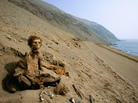 A photo from a recent National Geographic story shows a long-buried corpse, preserved by one of Earth's driest climates, Chile's Atacama Desert, where it has retained centuries-old skin, hair and clothing. A photo from a recent National Geographic story shows a long-buried corpse, preserved by one of Earth's driest climates, Chile's Atacama Desert, where it has retained centuries-old skin, hair and clothing.
