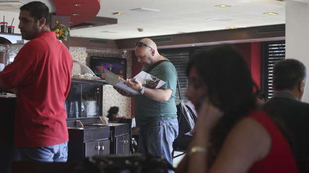 Palestinians order food at a coffee shop in the West Bank city of Ramallah on Sunday.