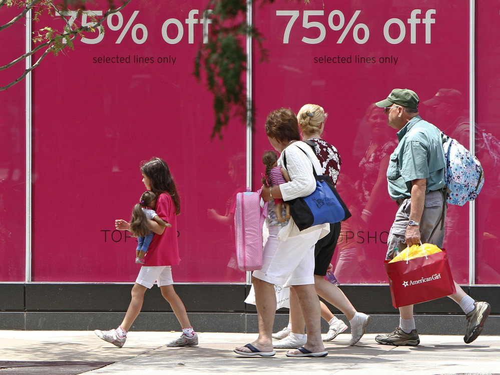 Shoppers walk along Chicago's Michigan Avenue last month.
