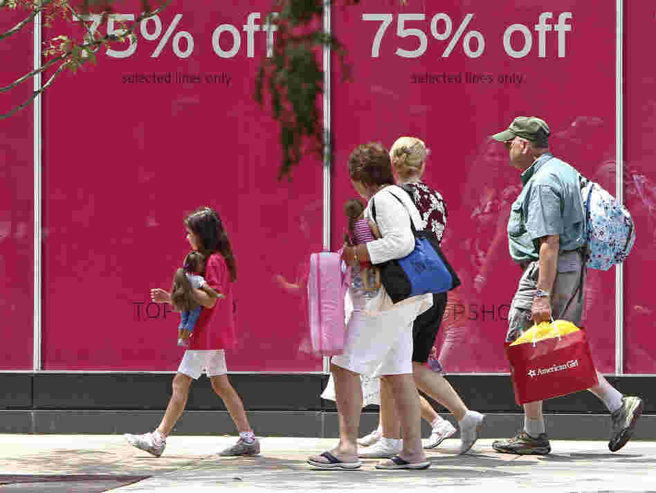 Shoppers walk along Chicago's Michigan Avenue last month.