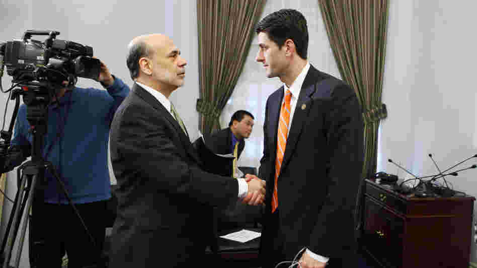 House Budget Committee Chairman Paul Ryan, R-Wis., shakes hands with Federal Reserve Chairman Ben Bernanke at the close of the committee's hearing on the state of the economy in February 2011.
