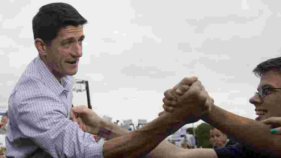 Rep. Paul Ryan greets supporters during a campaign rally Sunday in Waukesha, Wis.