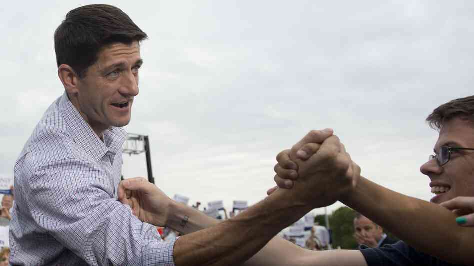 Rep. Paul Ryan greets supporters during a campaign rally Sunday in Waukesha, Wis.