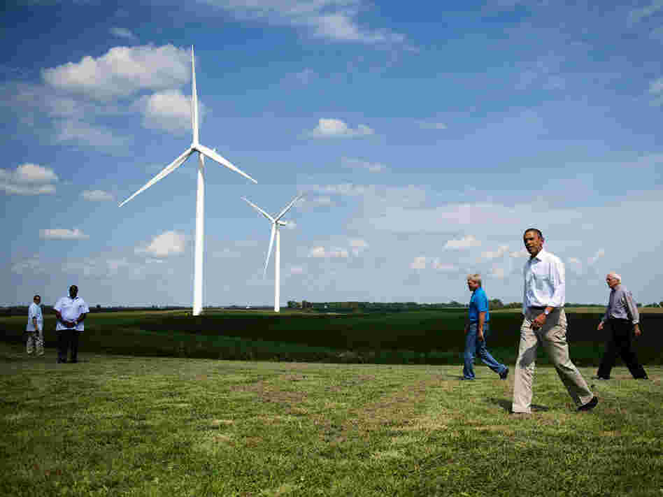 President Obama walks with members of the Heil family as he arrives to deliver remarks on wind power at the Heil Family Farm in Haverhill, Iowa, on Tuesday.
