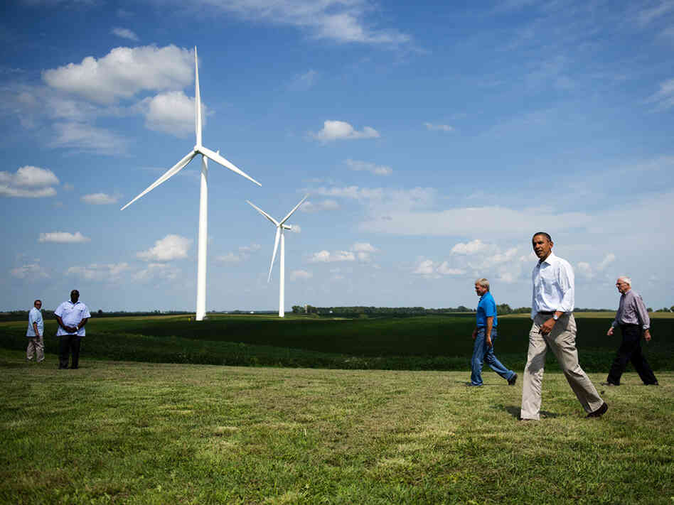President Obama walks with members of the Heil family as he arrives to deliver remarks on wind power at the Heil Family Farm in Haverhill, Iowa, on Tuesday.