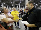 Sara Millan (left) thanks Neighborhood Assistance Corporation of America CEO Bruce Marks after NACA was able to reduce her family's mortgage during an event in Los Angeles in September 2010. Sara Millan (left) thanks Neighborhood Assistance Corporation of America CEO Bruce Marks after NACA was able to reduce her family's mortgage during an event in Los Angeles in September 2010.