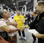 Sara Millan (left) thanks Neighborhood Assistance Corporation of America CEO Bruce Marks after NACA was able to reduce her family's mortgage during an event in Los Angeles in September 2010.