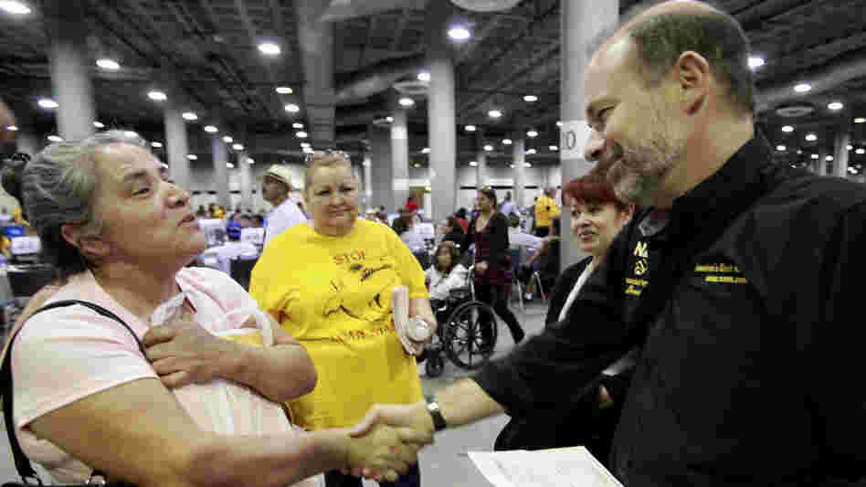 Sara Millan (left) thanks Neighborhood Assistance Corporation of America CEO Bruce Marks after NACA was able to reduce her family's mortgage during an event in Los Angeles in September 2010.