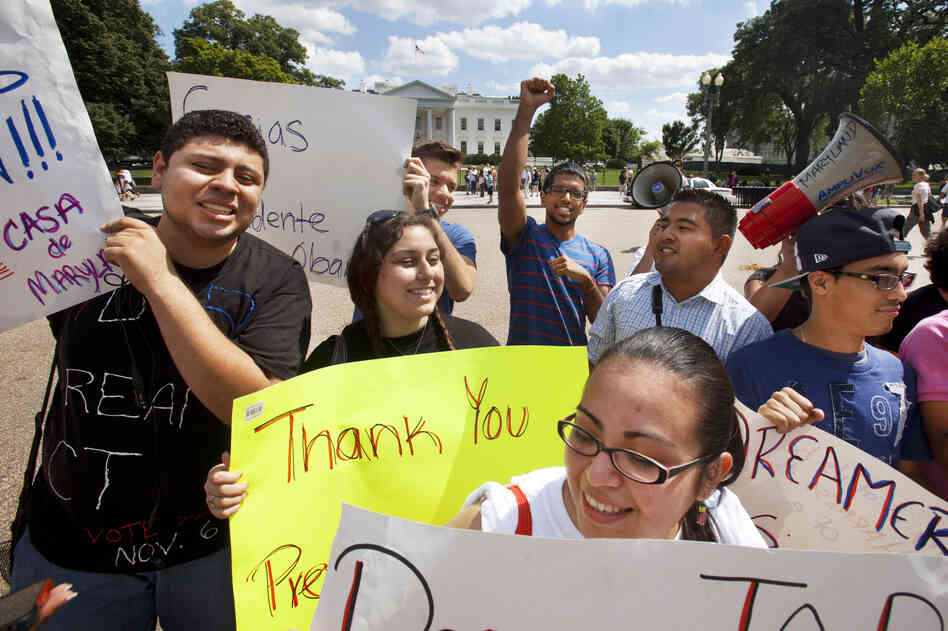 Ricky Campos, 23, and Katye Hernandez, 22, both illegal immigrants from El Salvador who live in Silver Spring, Md., hold signs saying "Thank You President Obama" after he announced the new policy in June. Ricky Campos, 23, and Katye Hernandez, 22, both illegal immigrants from El Salvador who live in Silver Spring, Md., hold signs saying "Thank You President Obama" after he announced the new policy in June.