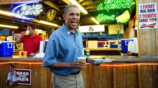 President Barack Obama gets a beer and a pork chop as he visits the Iowa State Fair in Des Moines. Earlier, the president gave a man at a coffee shop a bottle of the White House's home brew.