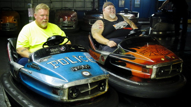 Keith Van Brunt (left) and Tom Mgerack, known as the "Bumper Car Psychos," go for a ride July 27 at the Keansburg Amusement Park in Keansburg, N.J. Keith Van Brunt (left) and Tom Mgerack, known as the "Bumper Car Psychos," go for a ride July 27 at the Keansburg Amusement Park in Keansburg, N.J.