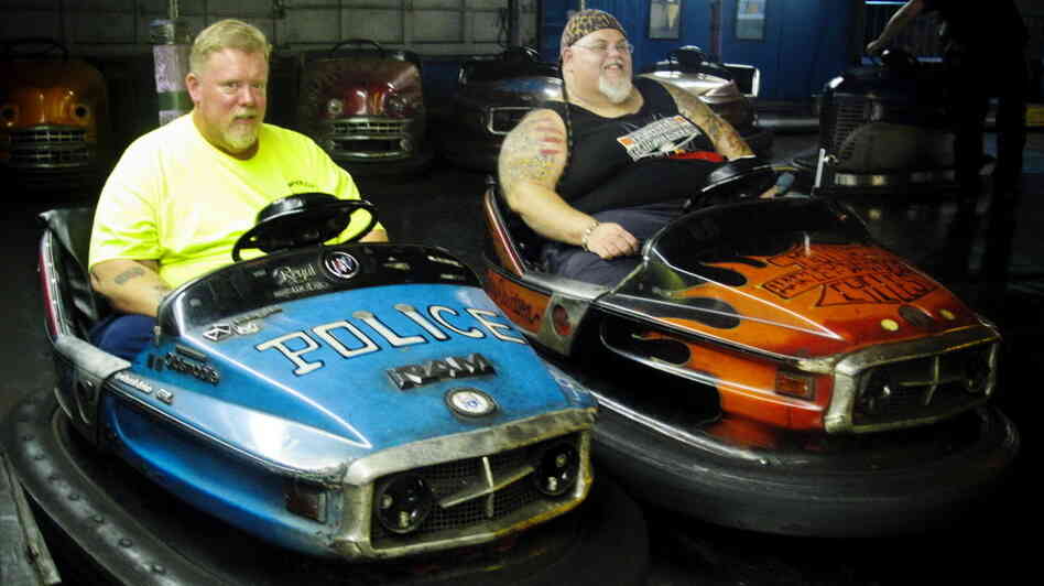 Keith Van Brunt (left) and Tom Mgerack, known as the "Bumper Car Psychos," go for a ride July 27 at the Keansburg Amusement Park in Keansburg, N.J. Keith Van Brunt (left) and Tom Mgerack, known as the "Bumper Car Psychos," go for a ride July 27 at the Keansburg Amusement Park in Keansburg, N.J.
