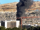 Smoke billows from a car bomb in Damascus, Syria. Smoke billows from a car bomb in Damascus, Syria.