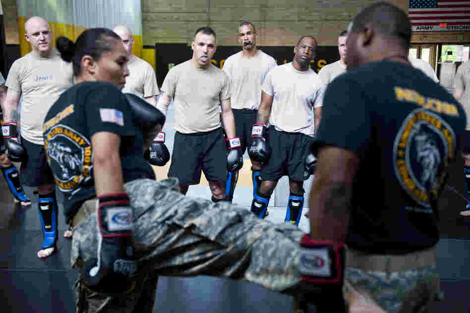Student instructors watch combat movements before a sparring exercise at the U.S. Army Combatives school. The Army has been conducting a study to see how many soldiers sustain concussions during the training.