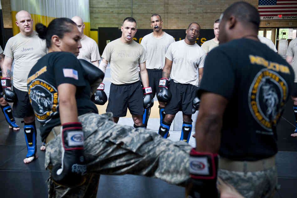 Student instructors watch combat movements before a sparring exercise at the U.S. Army Combatives school. The Army has been conducting a study to see how many soldiers sustain concussions during the training.