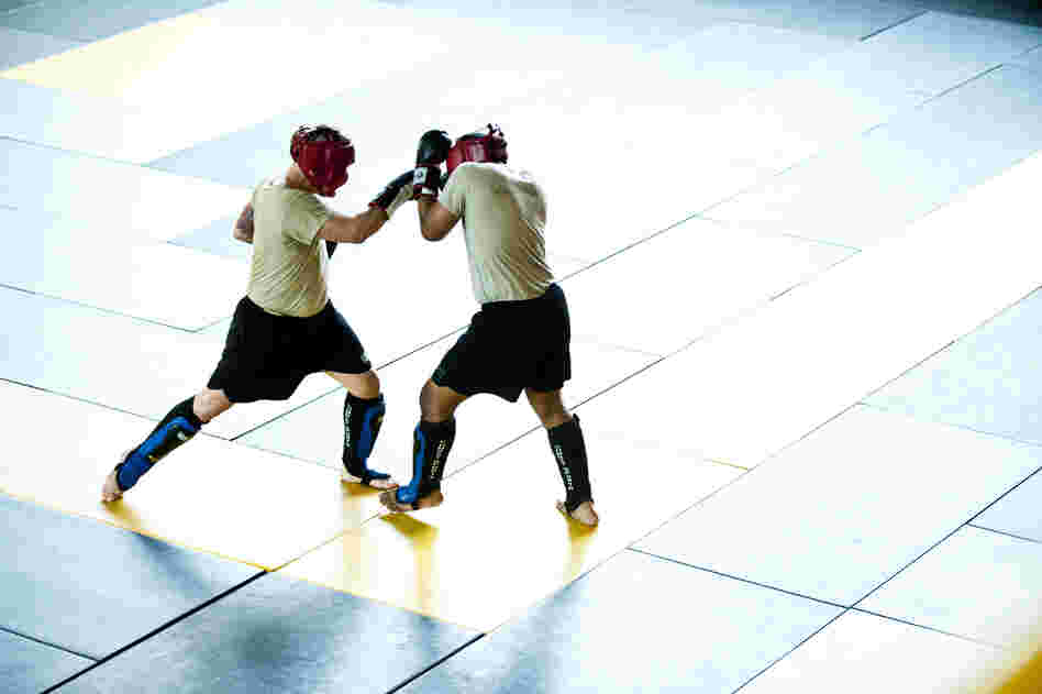 Students practice moves during a sparring session. Early findings in a research study suggest that, on average, one soldier is suffering a concussion every other day in combat classes.