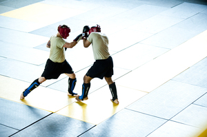 Students practice moves during a sparring session. Early findings in a research study suggest that, on average, one soldier is suffering a concussion every other day in combat classes.