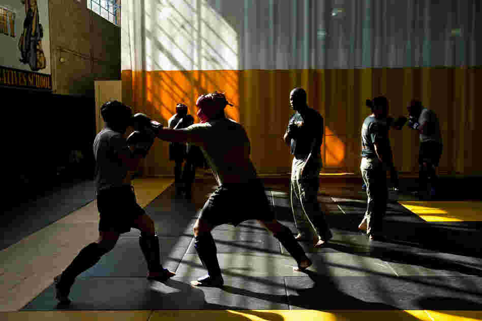 Instructors go through the gym watching the exercises.