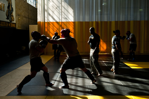 Instructors go through the gym watching the exercises.