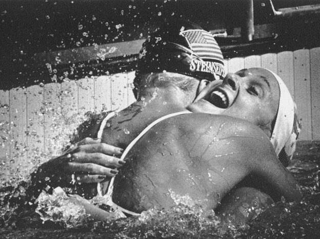 American swimmer Carrie Steinseifer, left, hugs Nancy Hogshead after they tied for the gold medal in the 100 meter freestyle competition during the 1984 Olympics.