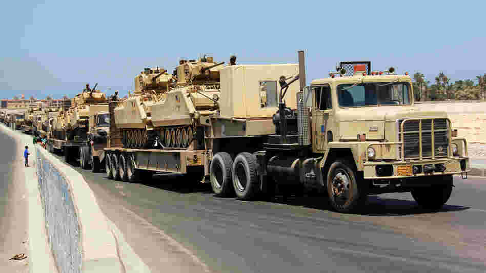 Army trucks carry Egyptian military tanks in El Arish, in the northern Sinai Peninsula, on Aug. 9. Security forces are conducting a major security campaign in the area after a deadly attack by masked gunmen on a border post left 16 soldiers dead. Army trucks carry Egyptian military tanks in El Arish, in the northern Sinai Peninsula, on Aug. 9. Security forces are conducting a major security campaign in the area after a deadly attack by masked gunmen on a border post left 16 soldiers dead.