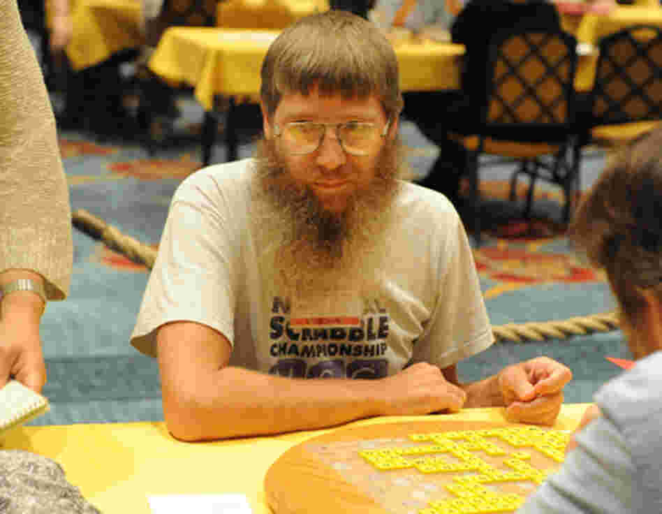 Four-time National Champion Nigel Richards. He won again today, becoming the first person to win four National Scrabble Championships and the first to win three titles in a row. A younger player, though, was caught cheating. Four-time National Champion Nigel Richards. He won again today, becoming the first person to win four National Scrabble Championships and the first to win three titles in a row. A younger player, though, was caught cheating.