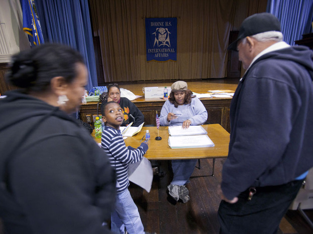 Pennsylvania voters show identification as they sign in to vote during the Republican primary in Philadelphia in April.