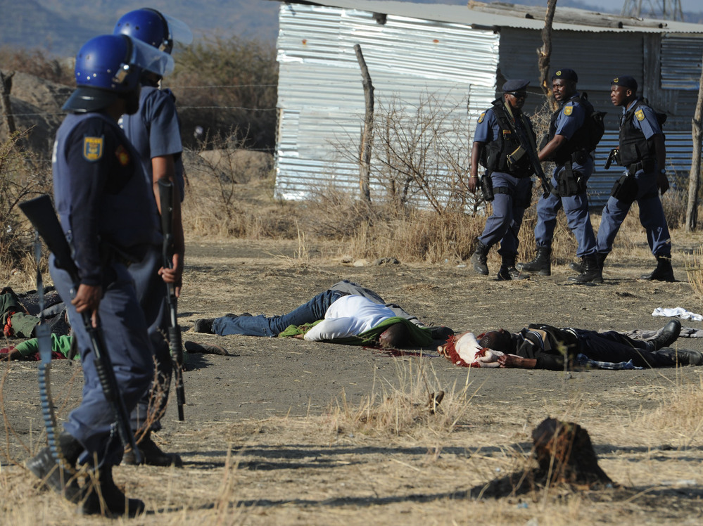 Police surround miners killed in Marikana, South Africa, on Thursday.